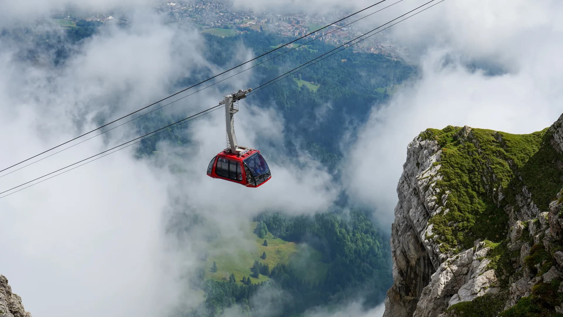 Cable car ascending Mount Pilatus with alpine views
